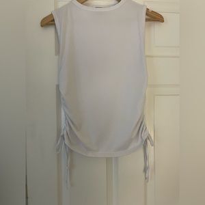 Cute White tee! ( cannot tighten sides of shirt w/ tie’s, they are design only)